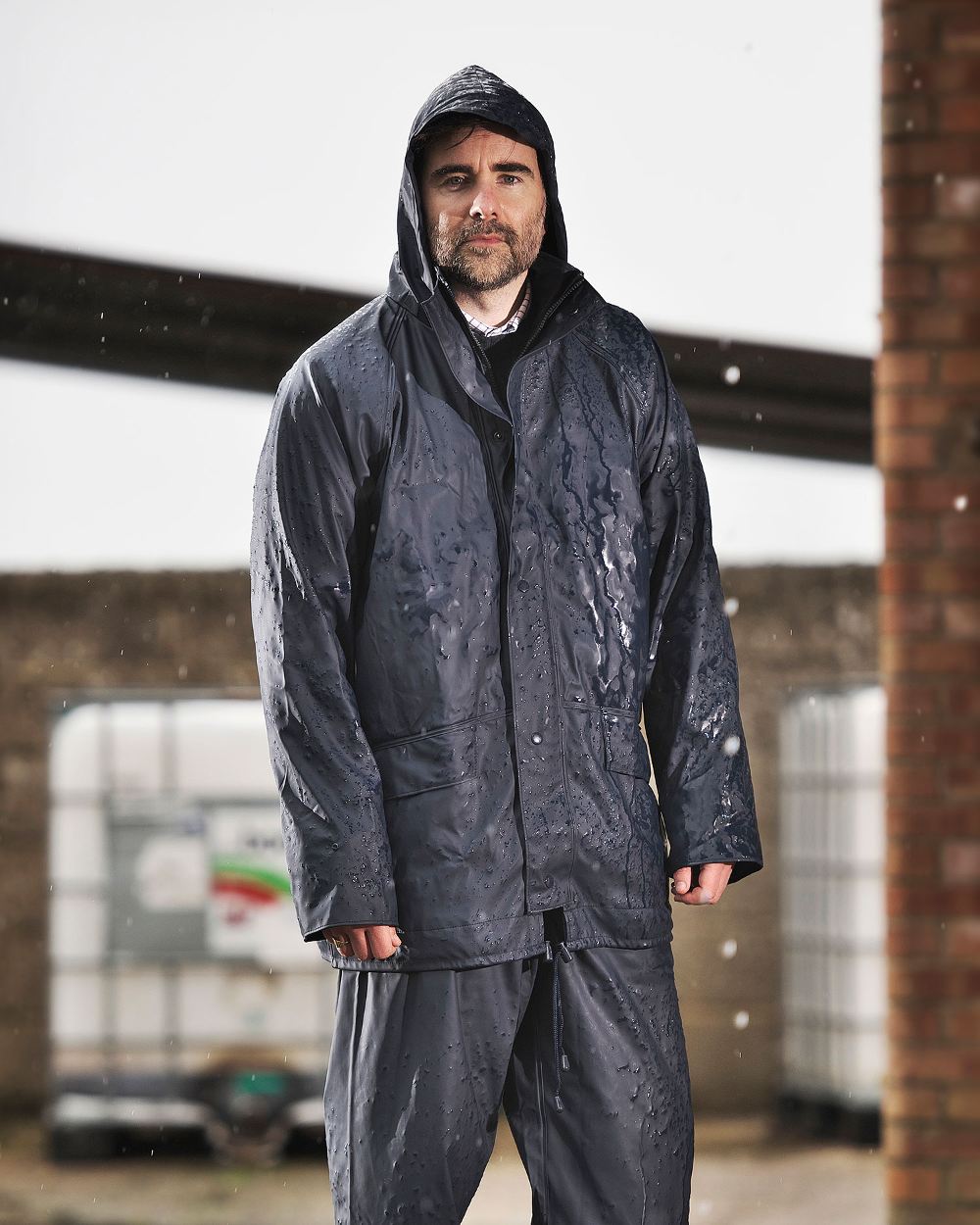 Navy coloured Fort Airflex Fortex Breathable Waterproof Jacket on blurry background