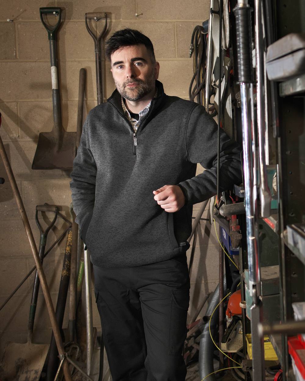 Grey coloured Fort Easton Half Zip Fleece Pullover on tools in background