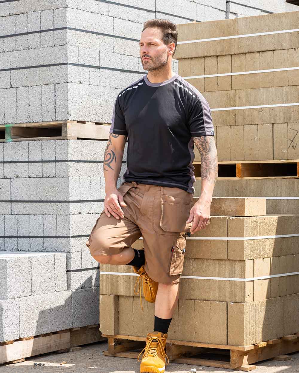 Sand Coloured TuffStuff Enduro Work Shorts On A Warehouse Background