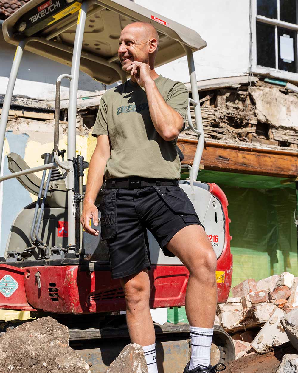 Black coloured TuffStuff Proflex Work Shorts on Model Courier