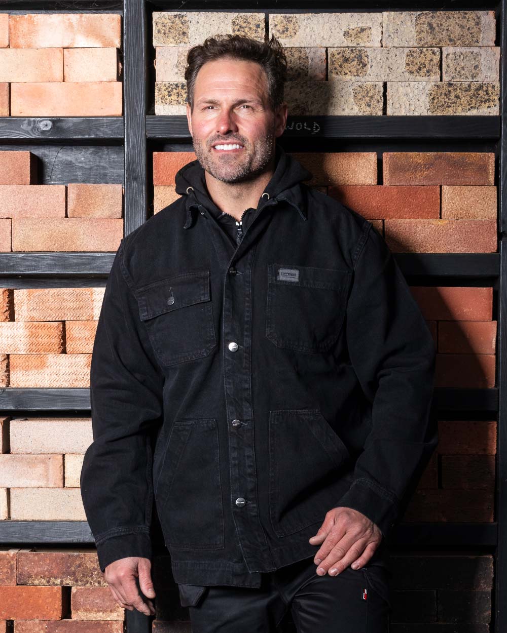 Black coloured TuffStuff Ranger Jacket with a warehouse background