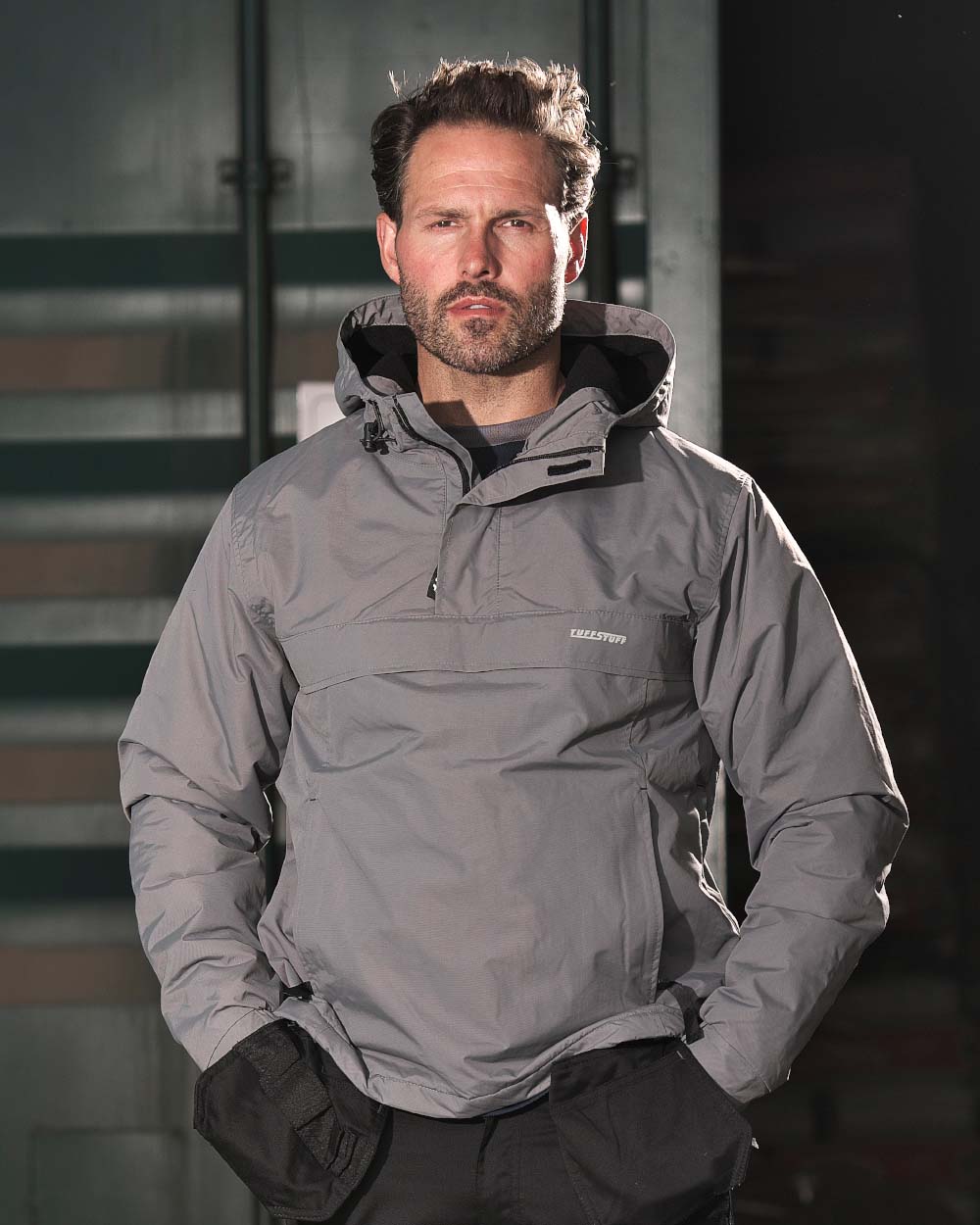Grey Coloured TuffStuff Sutherland Waterproof Windbreaker Smock On A Factory Background