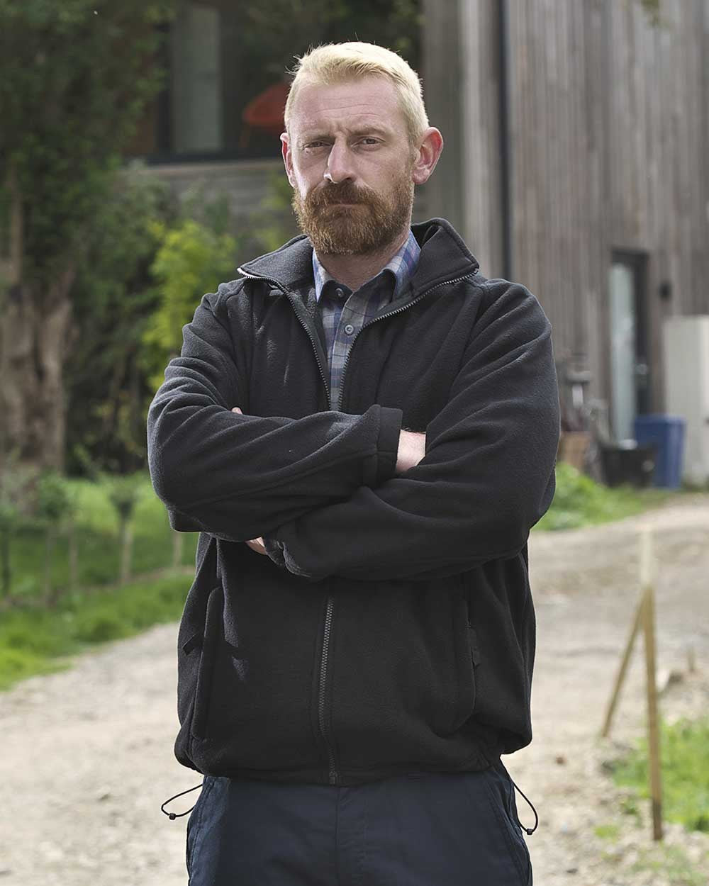 Black Coloured Fort Melrose Fleece Jacket On A Street Background