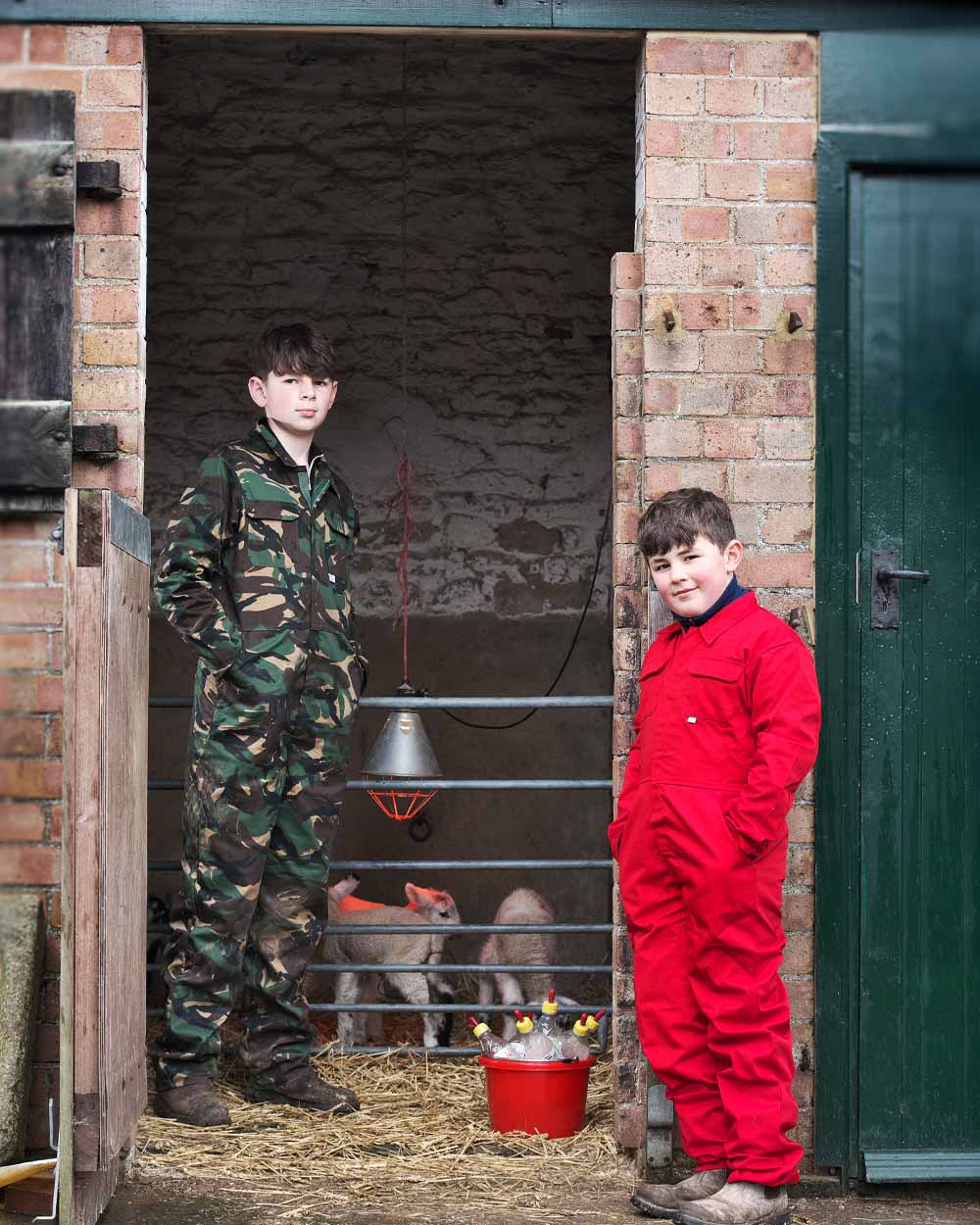 Red & Woodland coloured Fort Tearaway Junior Coverall on Farm background
