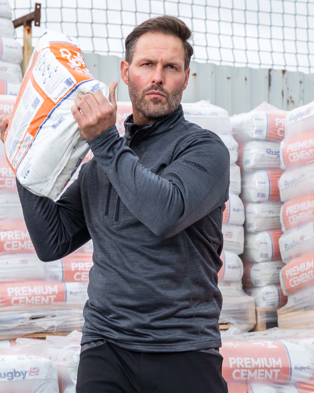 Grey coloured TuffStuff Camden Mid-Layer on Warehouse background colour_grey