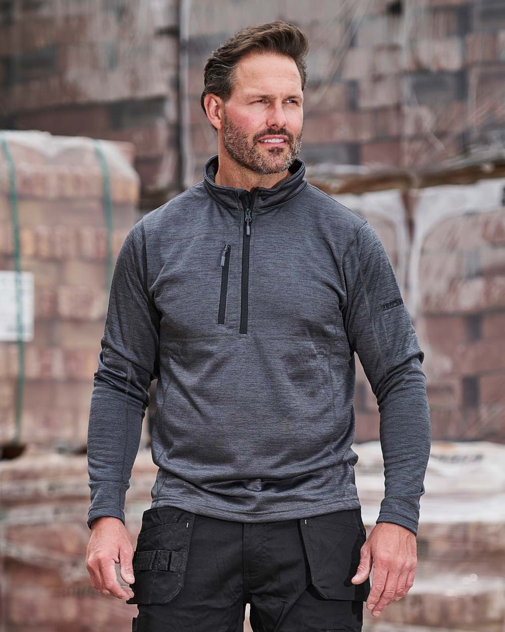Grey coloured TuffStuff Camden Mid-Layer on Warehouse background colour_grey