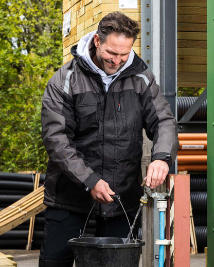 Black Coloured TuffStuff Cleveland Jacket On A Backyard Background 