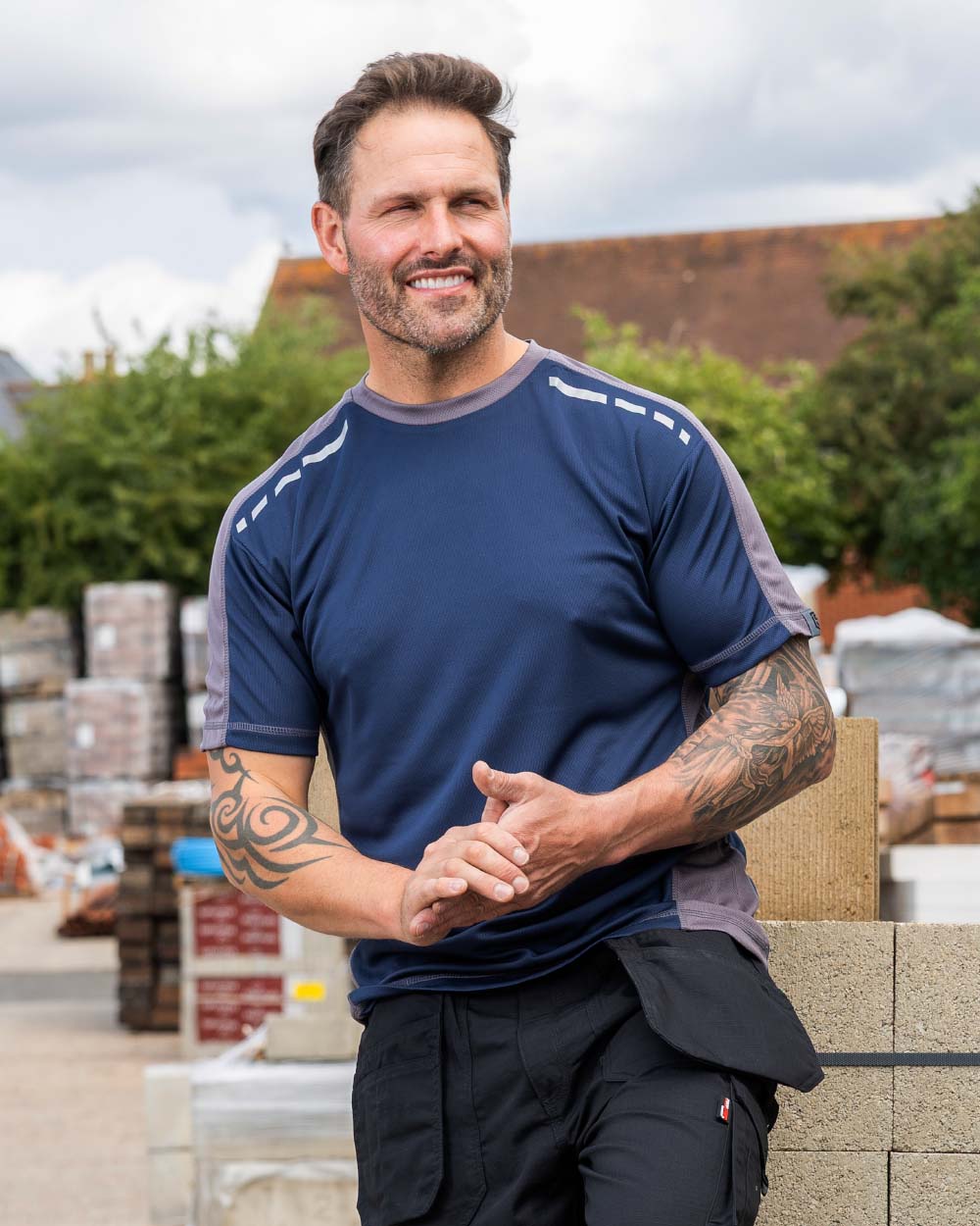 Navy Coloured TuffStuff Elite T-Shirt On An Industrial Background 