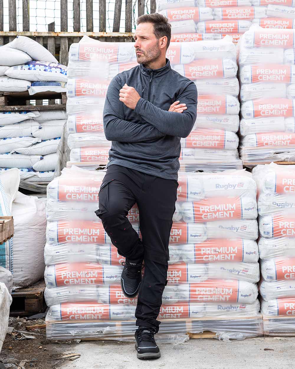 Black coloured TuffStuff Evo Flex Trousers in a warehouse background 