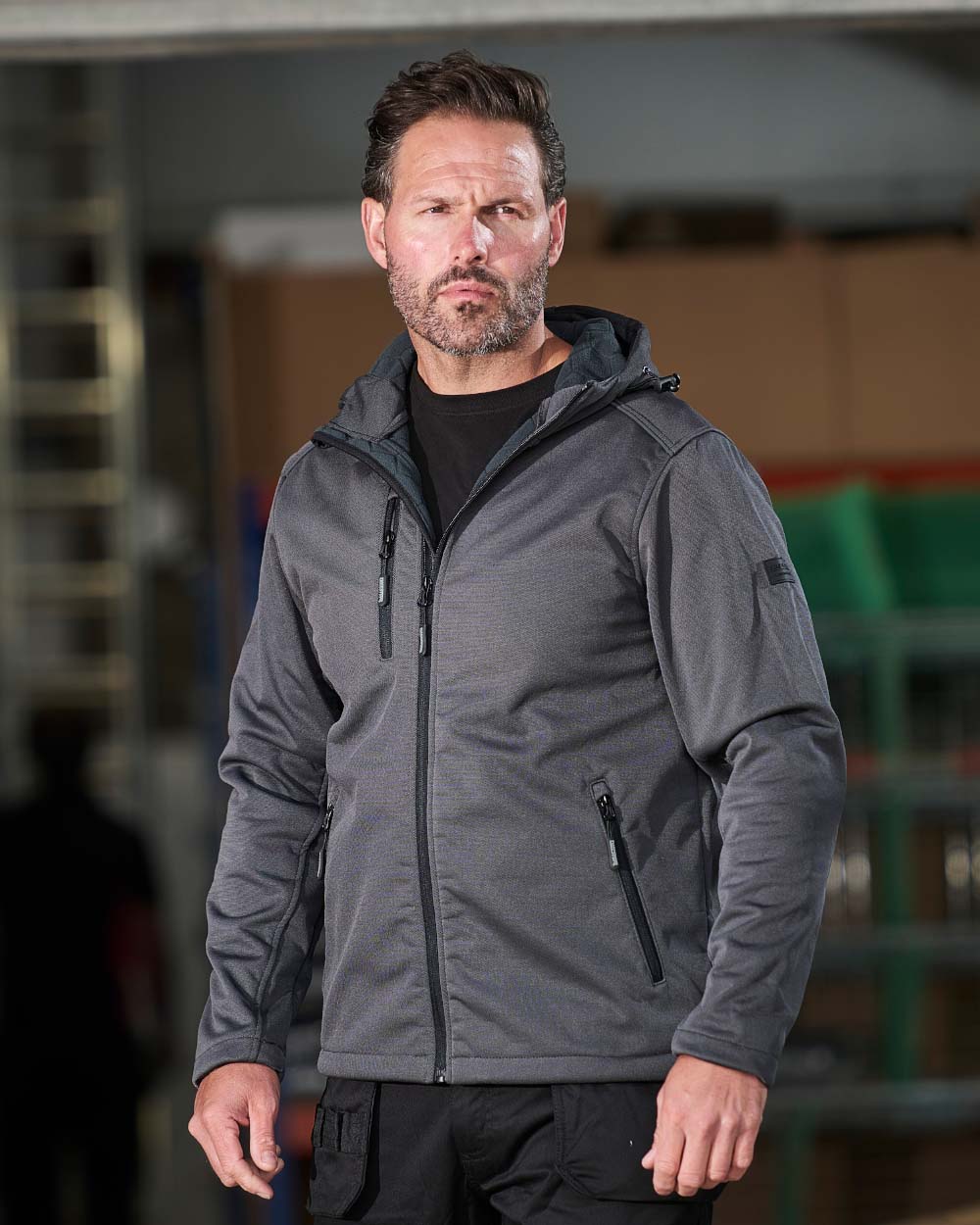 Grey Tuff Stuff Hale jacket in a warehouse background
