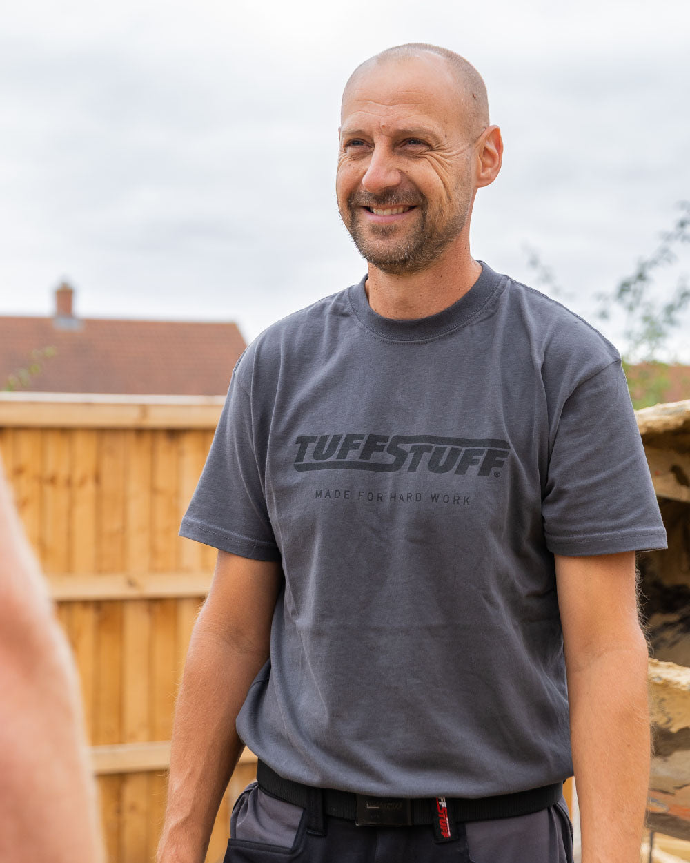 Grey coloured TuffStuff Logo T-Shirt in Residential background 