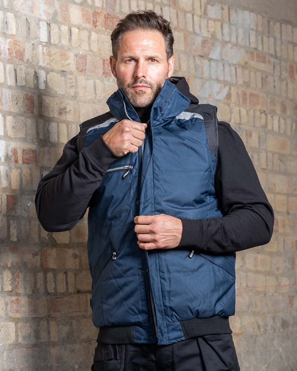 Navy Coloured TuffStuff Pro Work Bodywarmer  On A Street Background 