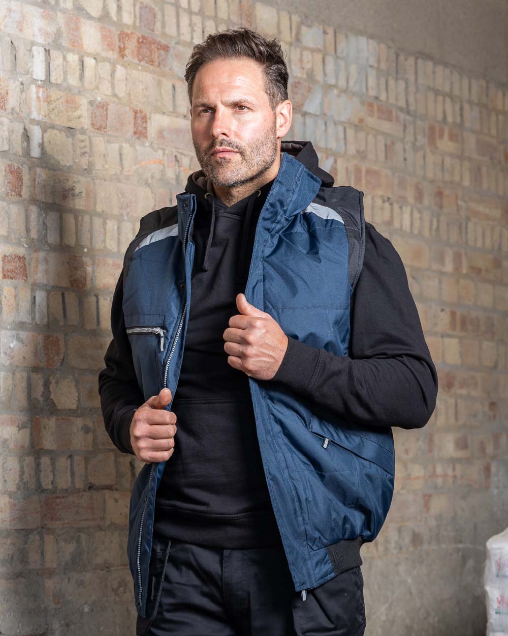 Navy Coloured TuffStuff Pro Work Bodywarmer  On A Street Background 