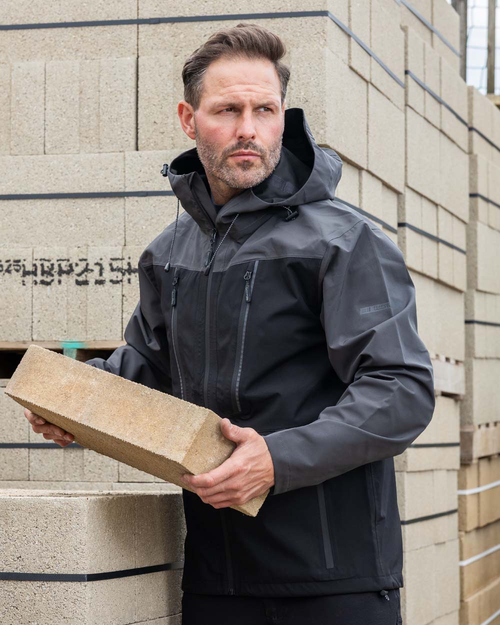 Black coloured TuffStuff ProShell Jacket on urban background 