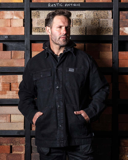 Black coloured TuffStuff Ranger Jacket with a warehouse background
