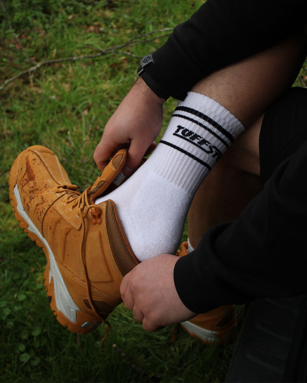 White TuffStuff Crew Socks with a grassy background